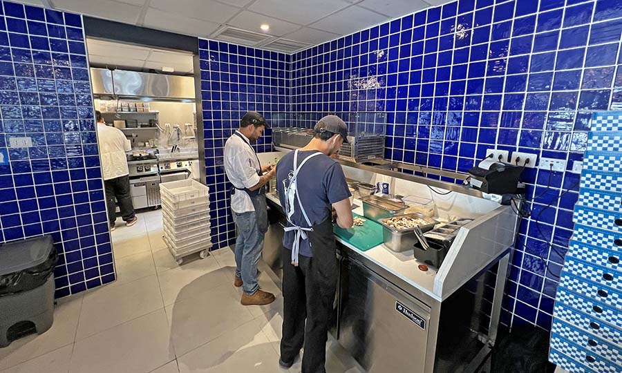 La zona de pizza y cocina de Brunapoli La Reina - Brunapoli - La Reina
